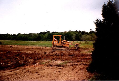 Marshall Stuart grading a job site next to his parents' property in Ohio, 1980