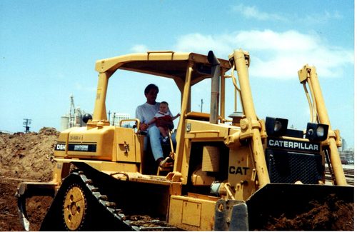 Marshall Stuart with his son Kendall on a Caterpillar D6 bulldozer, 1992