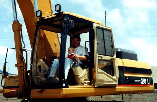 Marshall Stuart with his son Brad in an excavator, 1997